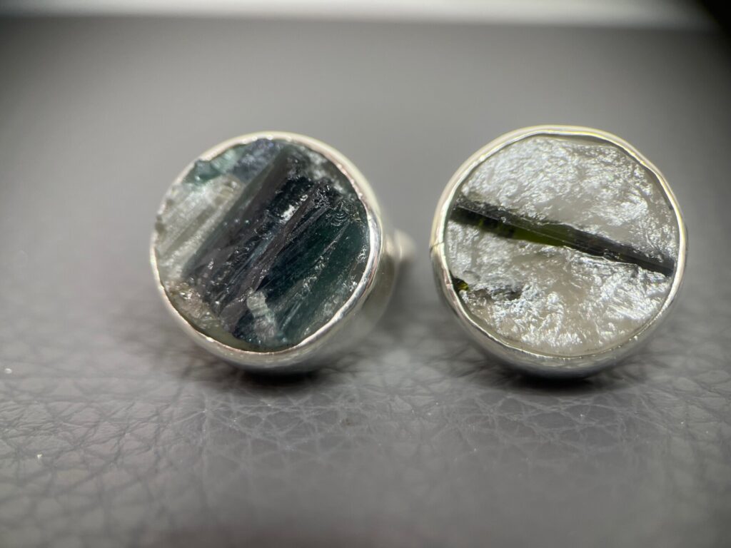 pair of silver cufflinks with round rough quartz with tourmaline stones